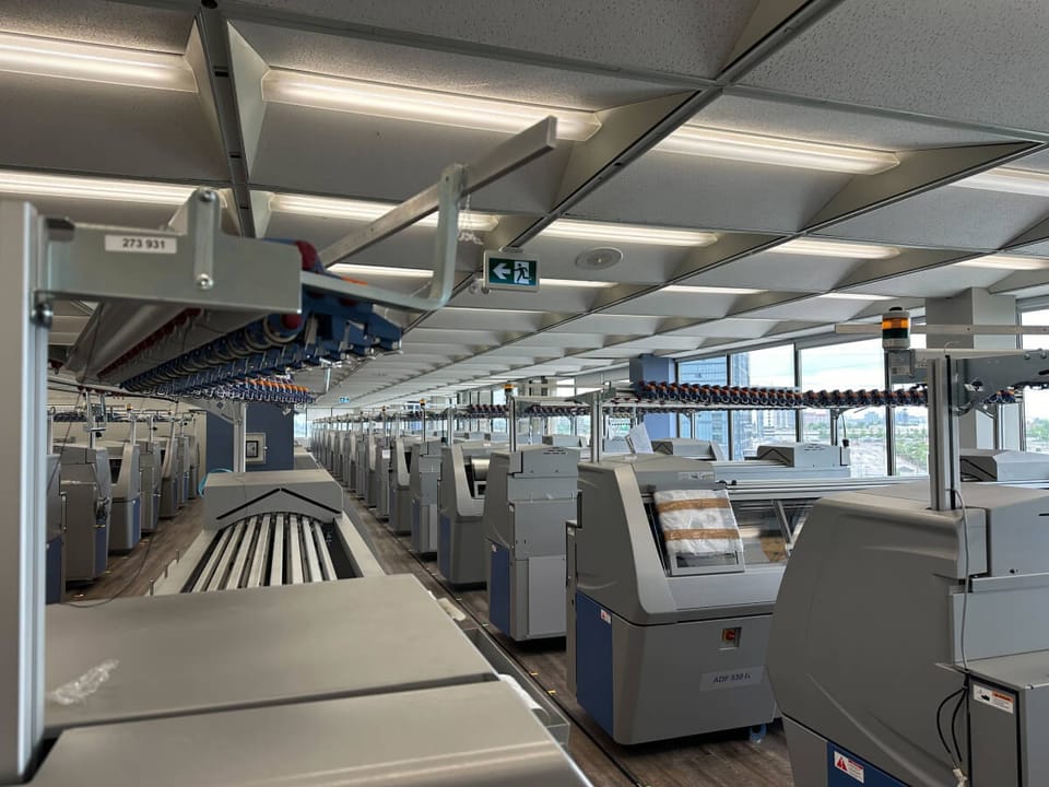 The production floor — industrial knitting machines in operation