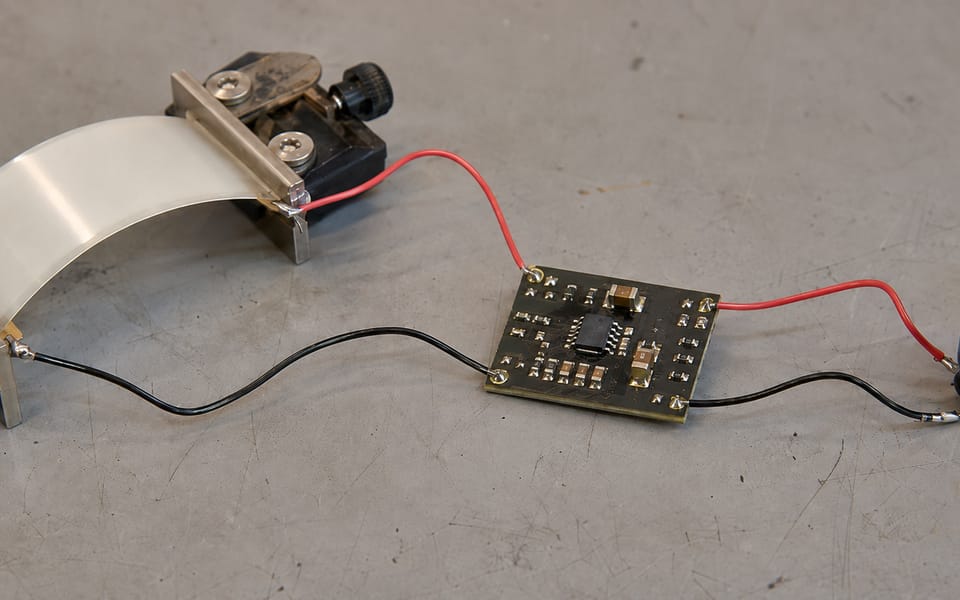 A piezoelectric element wired to a storage capacitor and control board