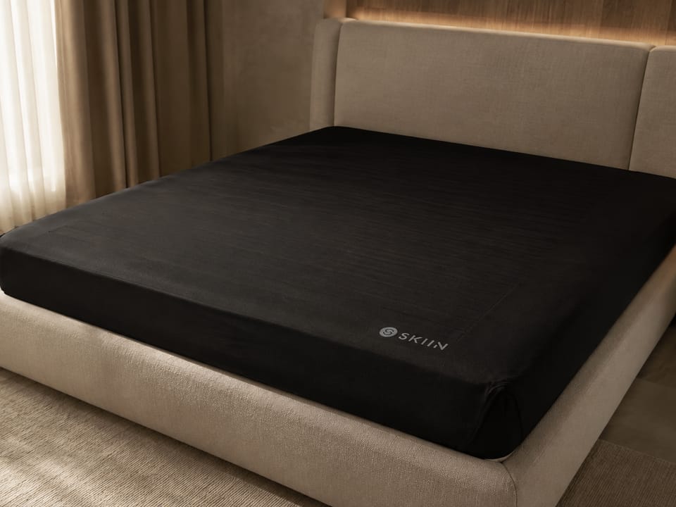 A dual-zone sensing bed made up in a calm bedroom