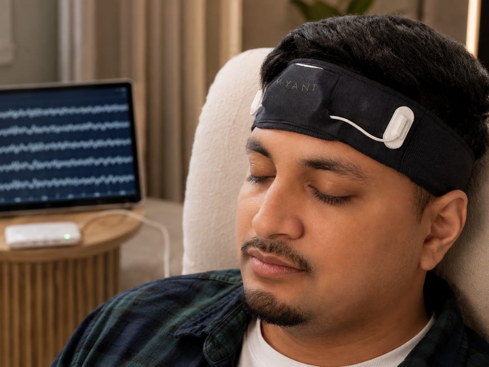 A soft MYANT textile EEG headband worn at rest, multi-channel traces on a tablet