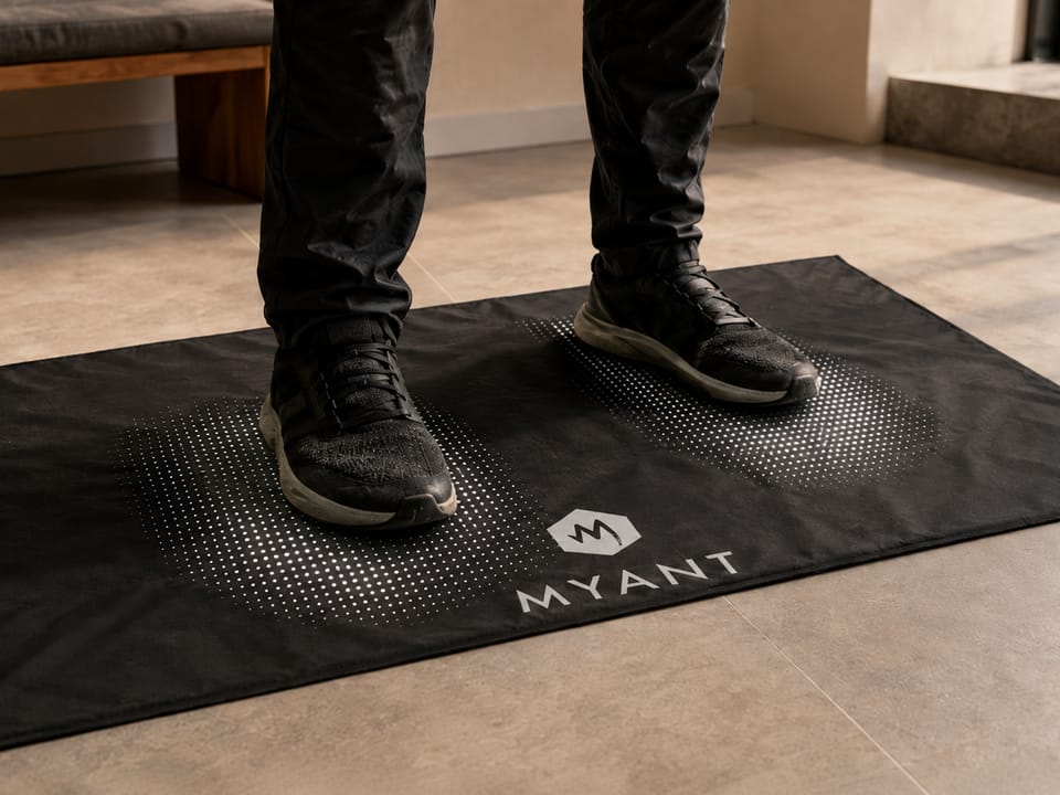 A MYANT textile pressure mat resolving foot load across its sensing surface