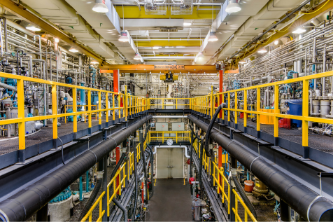 Interior view of Myant X's advanced materials facility showcasing industrial equipment and technology.
